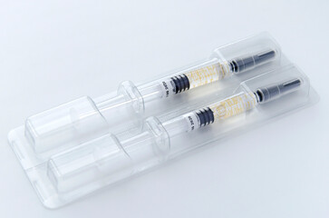 Syringe on a white