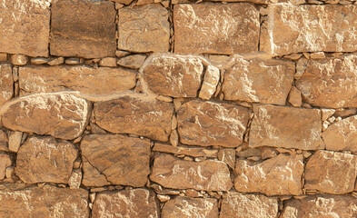 detail of the limestone wall of the Nabaean fortress in Wadi Nahal Nekarot on the Spice Route in Israel showing the reconstructed area above the original