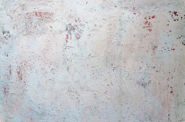 White and pink stucco wall. Texture. Background. Close-up.
