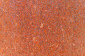 Background of rusty weathering corten steel. Steel alloy with a stable rust-like appearance used in...