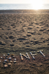 Concept of non-fungible NFT tokens. NFT text made from stones