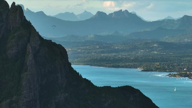 Parallax effect. Aerial view of the high peak of the mountain. The background moves very fast.