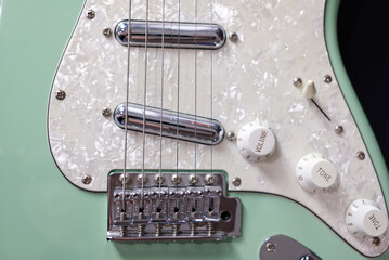 Electric Guitar close-up strings and pickups