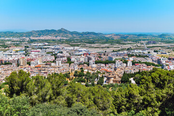Fototapeta na wymiar Panoramic scenery to Xativa townscape view from Castle. Spain