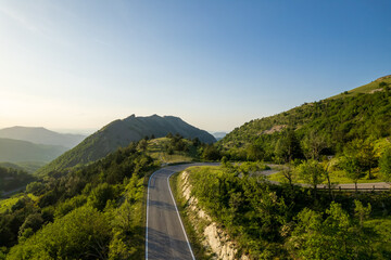 Naklejka premium Aerial view of curvy road on monte Nerone slope in Marche region in Italy 