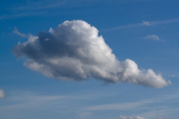 white-gray cloud against the blue sky
