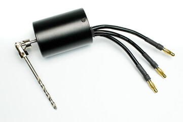 Electric micro drill for drilling of printed circuit boards (PCB). Small drilling machine. Three phase brushless black motor with cables. Selective focus. Isolated on white background.