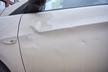 Car body side damage, traffic accident in winter season. Car door damage, broken and damaged side mirror on car door. - obrazy, fototapety, plakaty