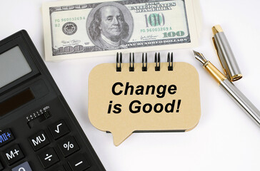 On a white surface, a calculator, dollars, a pen and a sign with the inscription - Change is Good