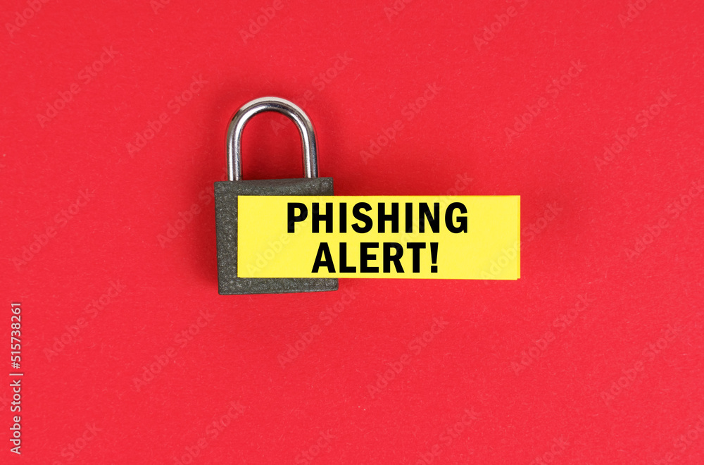 Poster on the red surface there is a lock with a sticker with the inscription - phishing alert