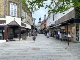 pedestrian zone with shops in the town centre of Lemvig with view to the church tower, Jutland,...