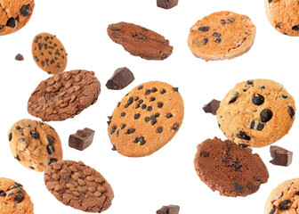 Delicious chocolate chip cookies falling on white background