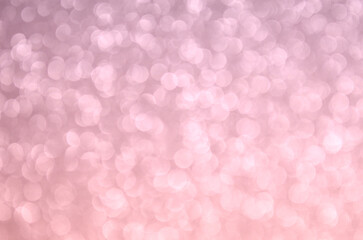 Fondo glitter con efecto bokeh desenfocado de color degradado gris y rosa. Se puede usar como fondo