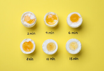 Different cooking time and readiness stages of boiled chicken eggs on yellow background, flat lay