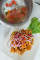Top view of a plate with ceviche ready to serve