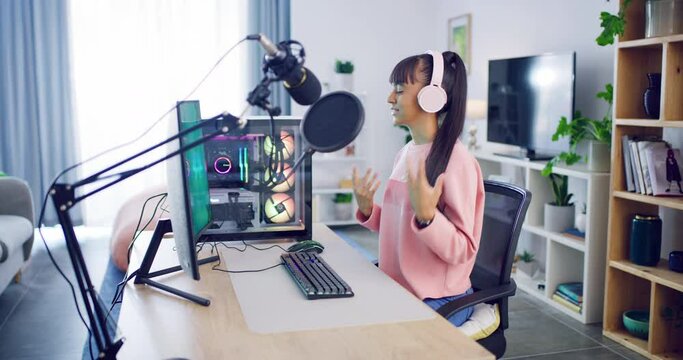 Gaming vlogger recording and streaming a podcast. Young podcaster with headphones recording an audio or videocast online for social media. Broadcast radio host or influencer sharing live content