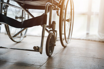 Close up view of empty wheelchair waiting for patient services with vintage filtered.