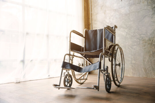 Close up view of empty wheelchair waiting for patient services with vintage filtered.