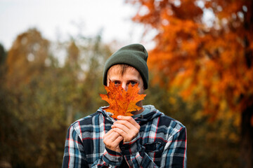 Man with autumn leaves