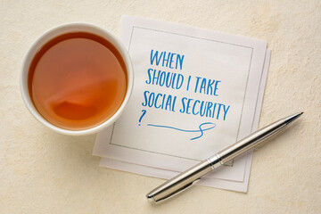 When should I take social security? Retirement and finance planning question, handwriting on napkin with tea.