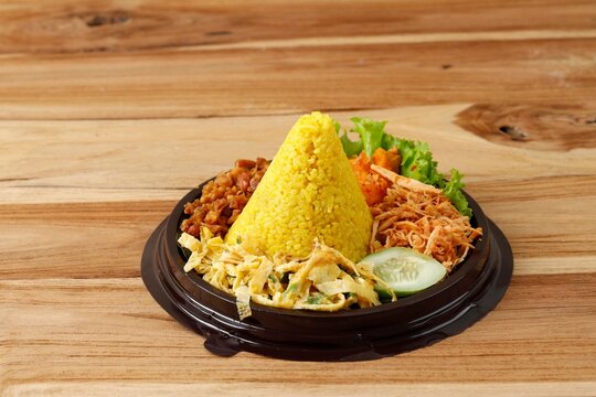 Mini Tumpeng Made of Yellow Rice with Some Side Dishes, Ready to Eat, Served for Agustusan Indonesia Independence Day