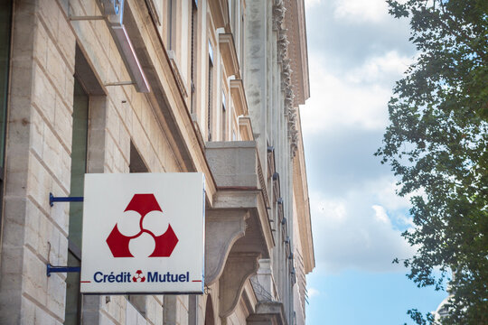 LYON, FRANCE - JULY 13, 2019: Credit Mutuel logo in front of their local bank in Lyon. Credit Mutuel is a cooperative bank, one of main french banks and insurance services