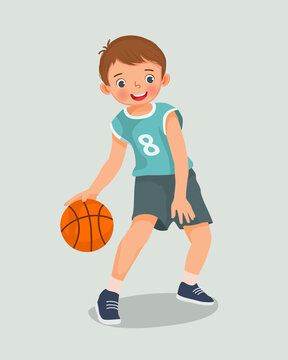 cute little boy with sportswear playing basketball dribbling the ball in action
