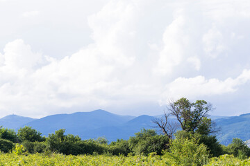 Thunderhead covers the Balkans. Downpour is approaching agricultural land. Villages, fields and...