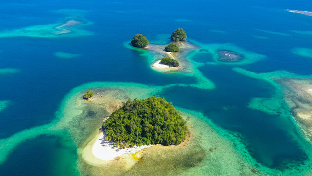 Aerial drone of Seascape with beautiful beach. Britania Islands, Surigao del Sur, Philippines.