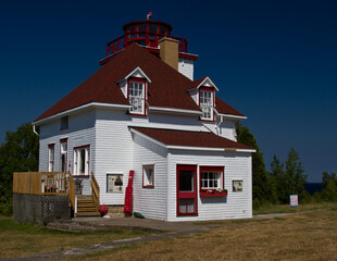large lighthouse with blue sky