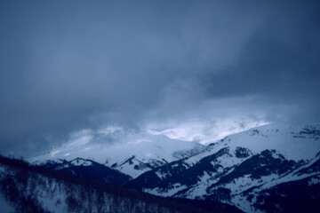Fototapeta premium Image of a mountain covered with a snow cloud.