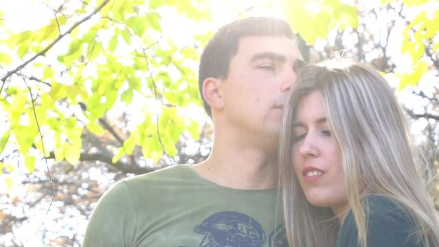 Slow Motion portrait of a romantic couple in an autumn city park