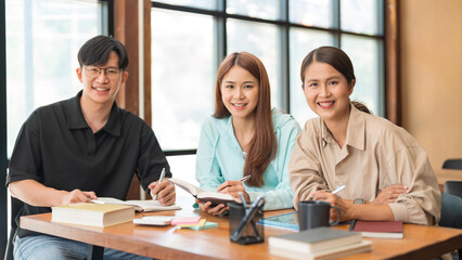 Education concept, Female tutor and students smiling and looking on camera while study tutorial