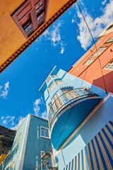 Beautiful historical and old colorful residential buildings in the city of Santa Cruz de La Palma. Low angle of bright and vibrant homes or houses in an old village or town © SteenoWac/peopleimages.com