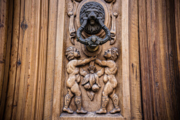 Old wooden door texture with lock and knob. Door of ancient building in Toledo, Spain