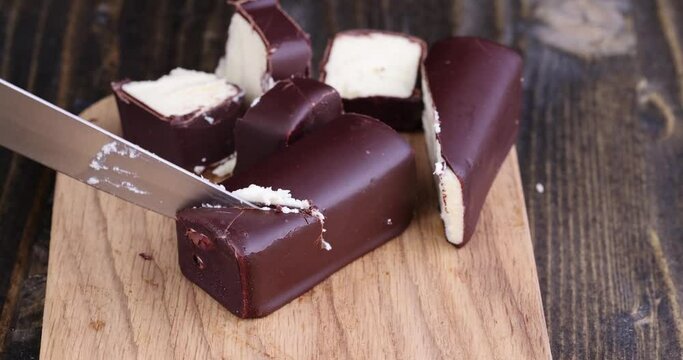 Chilled cottage cheese with sugar in chocolate