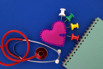 Medical concept with stethoscope and red heart