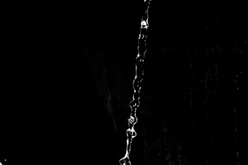 water splashes isolated on black background. white jets with drops