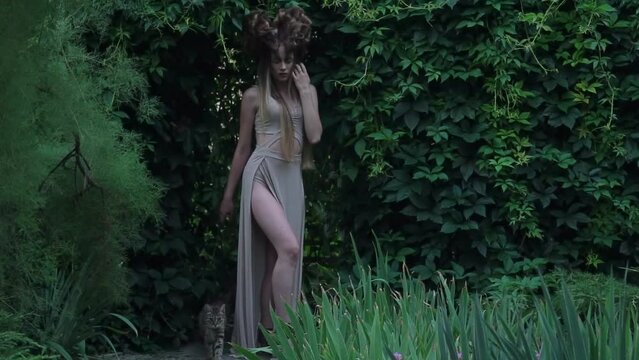 Slow Motion elegant mystic elf in dress in woods