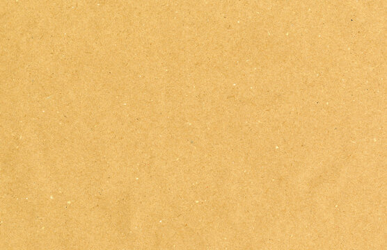 Highly detailed brown cardboard recycled uncoated smooth paper texture scan with dust and colorful particles with copyspace for text for high resolution wallpaper or mockup
