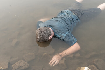 a dead man was found near the river, a dead man was drowned in a pond lake swamp