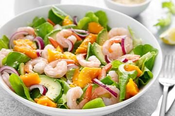 Shrimp, avocado and mango salad with fresh green lettuce. Prawn salad