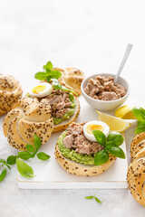 Canned tuna open sandwiches. Buns burgers with canned tuna, boiled egg and avocado