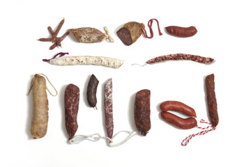 high angle view of collection of various sausage on white background