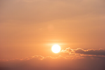 Sunset sky with sun during sunset time in Thailand.
