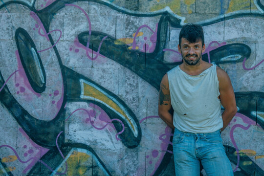 Young man portrait on graffiti grunge wall