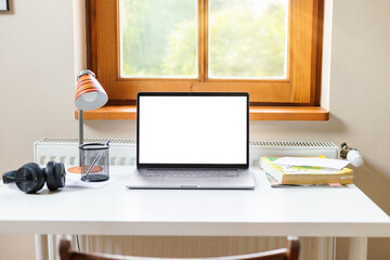 Modern freelance designer workplace in home office with laptop computer mockup. Remote education, online learning concept. Copy space