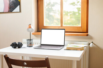 Modern home office working space with laptop computer mockup. Remote work outside the office concept