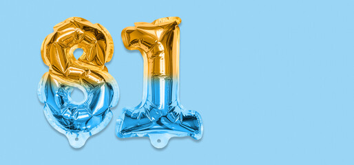 Rainbow foil balloon number, digit eighty one on a blue background. Birthday greeting card with inscription 81. Top view. Numerical digit. Celebration event, template. Banner