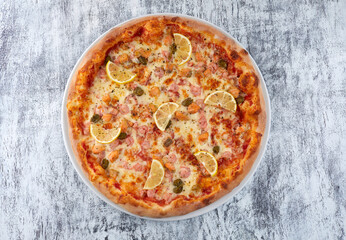fresh pizza on the white plate